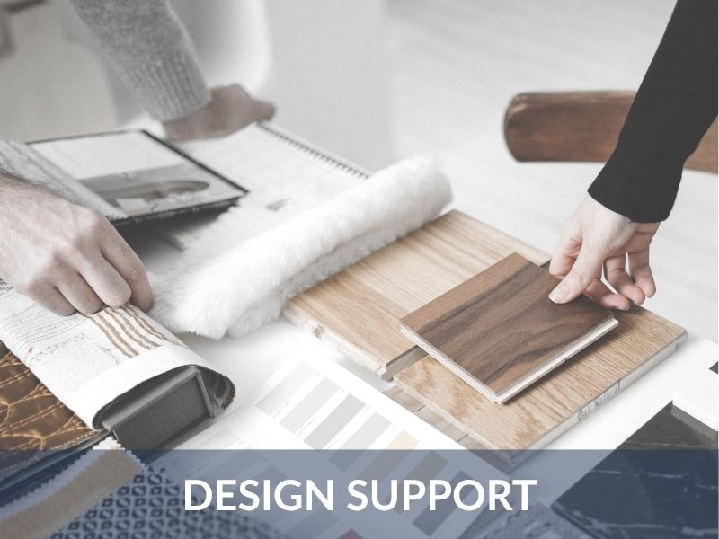 Designer and homeowner reviewing countertop and tile selections