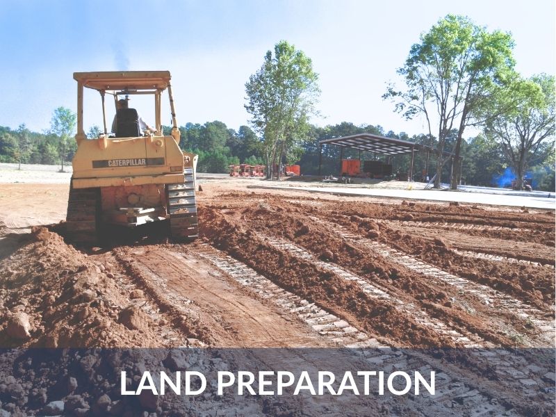 Dozer grading a lot for house pad before construction begins