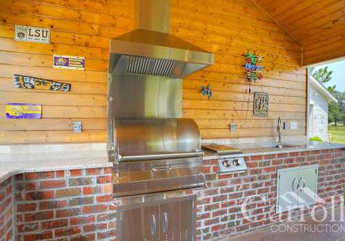 Outdoor kitchen with grill and side burner