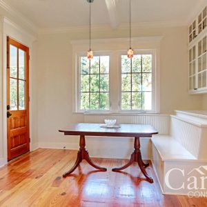Customized Liberty Plan – Breakfast nook with built-in bench seating and wood door to back porch