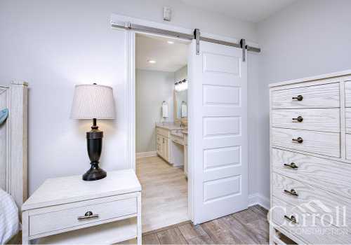 Sliding barn door leads to the large master bathroom