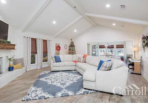 Wide view of the family room, custom flooring, and scenic view