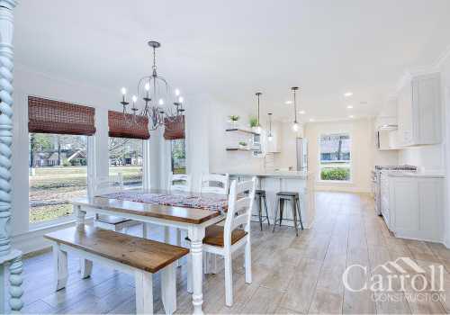 Dining and full kitchen view inside a Carroll Construction new home