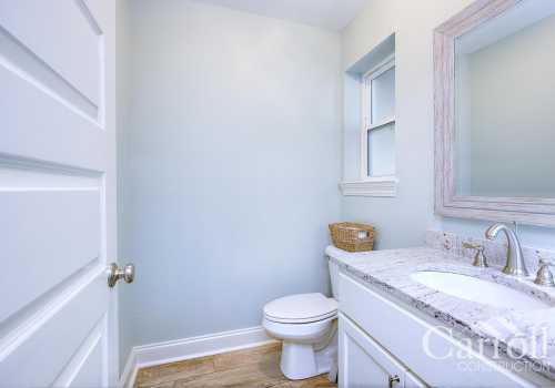 A cozy guest bathrom with undermount sink and granite counters