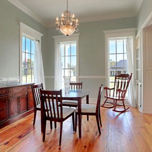 Customized Liberty Plan – Dining room with paneled casement opening and built-in china cabinets