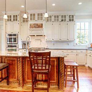 Customized Liberty Plan – Kitchen with reclaimed pine barnwood island and full-height cabinets with glass