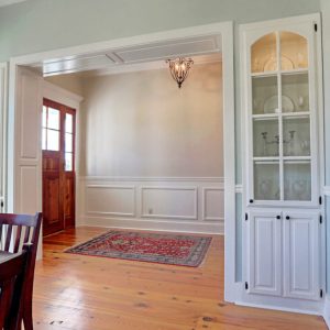 Customized Liberty Plan – Dining room view toward built-in china cabinets and foyer