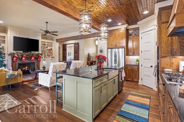 Neutral tone craftsman style home with lots of stained wood features.