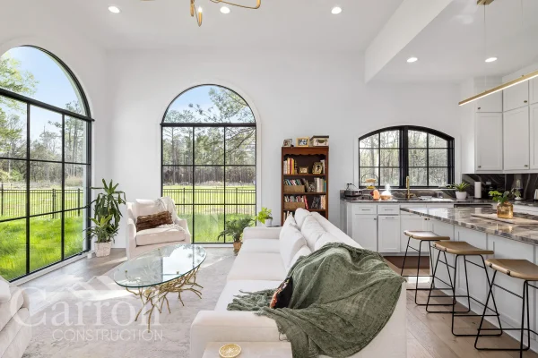 Living Area with Large Windows and Open Layout – Morrison Mother-in-Law Suite Open-concept living and kitchen area with slimline windows and natural light in a modern mother-in-law suite