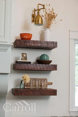 Floating reclaimed pine shelves on kitchen wall for open storage and display