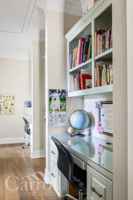 Double desk nook designed for homeschooling, built into hallway for Carroll children