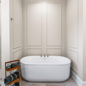 Dittmar Home – Liberty plan, 2,574 SF – master bathroom with paneled wall and tub featuring custom moulding surround.